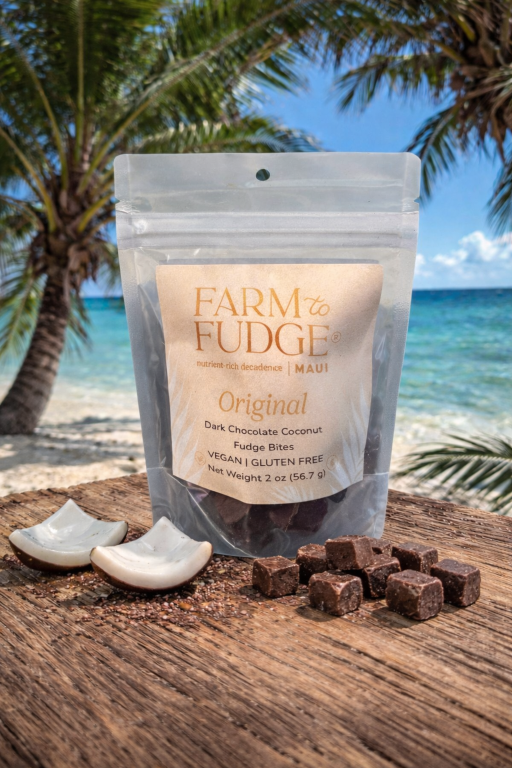 Farm Fudge packaging with fudge pieces on a wooden surface by a beach.