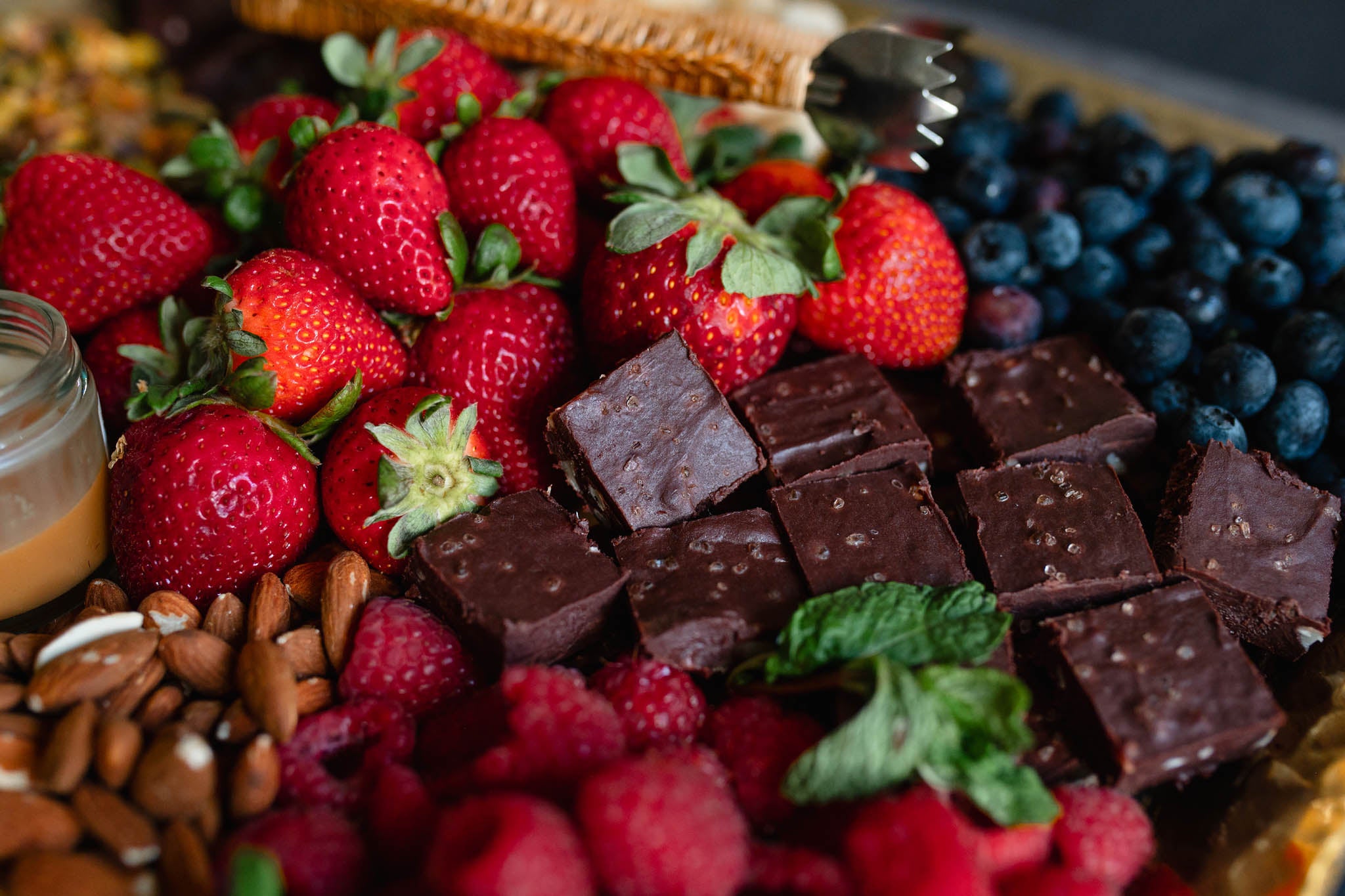 Strawberries and berries with  vegan fudge 
